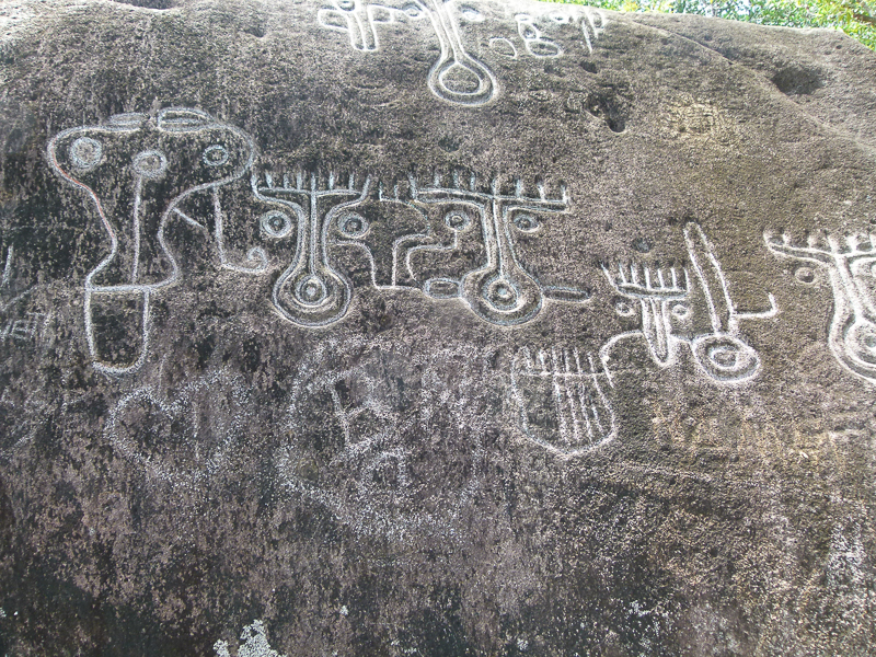 Some modern graffiti alongside the authentic drawings and carvings