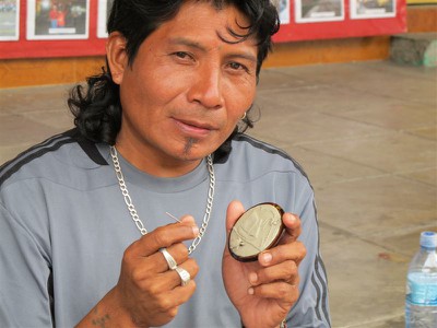 Kuna Indian sculpting scenes with clay